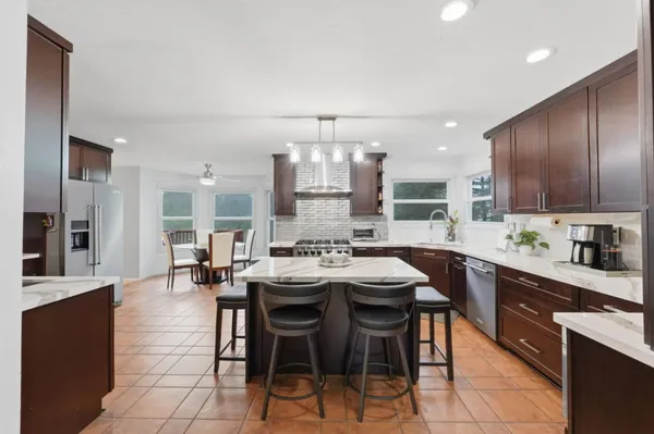 a kitchen with a stove and a microwave