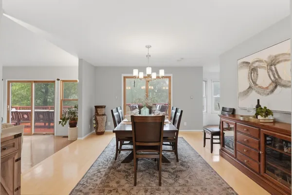 a view of a dining room with furniture window and wooden floor