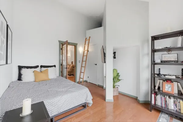 a living room with furniture a window and a lamp