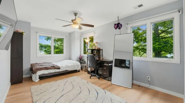 a view of a room with wooden floor