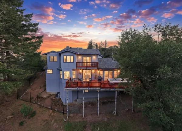 a view of a chairs and table in backyard