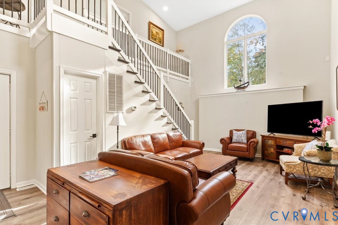 517 West Riverside Drive Lanexa, VA 23089 - Photo 5 of 27 a living room with furniture and a flat screen tv