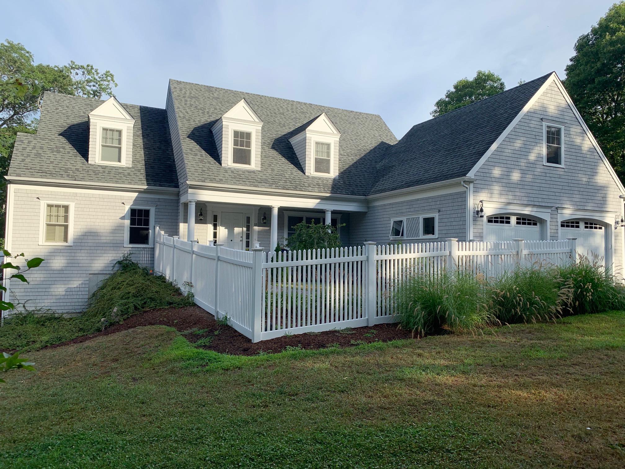 a view of a house with a yard and plants