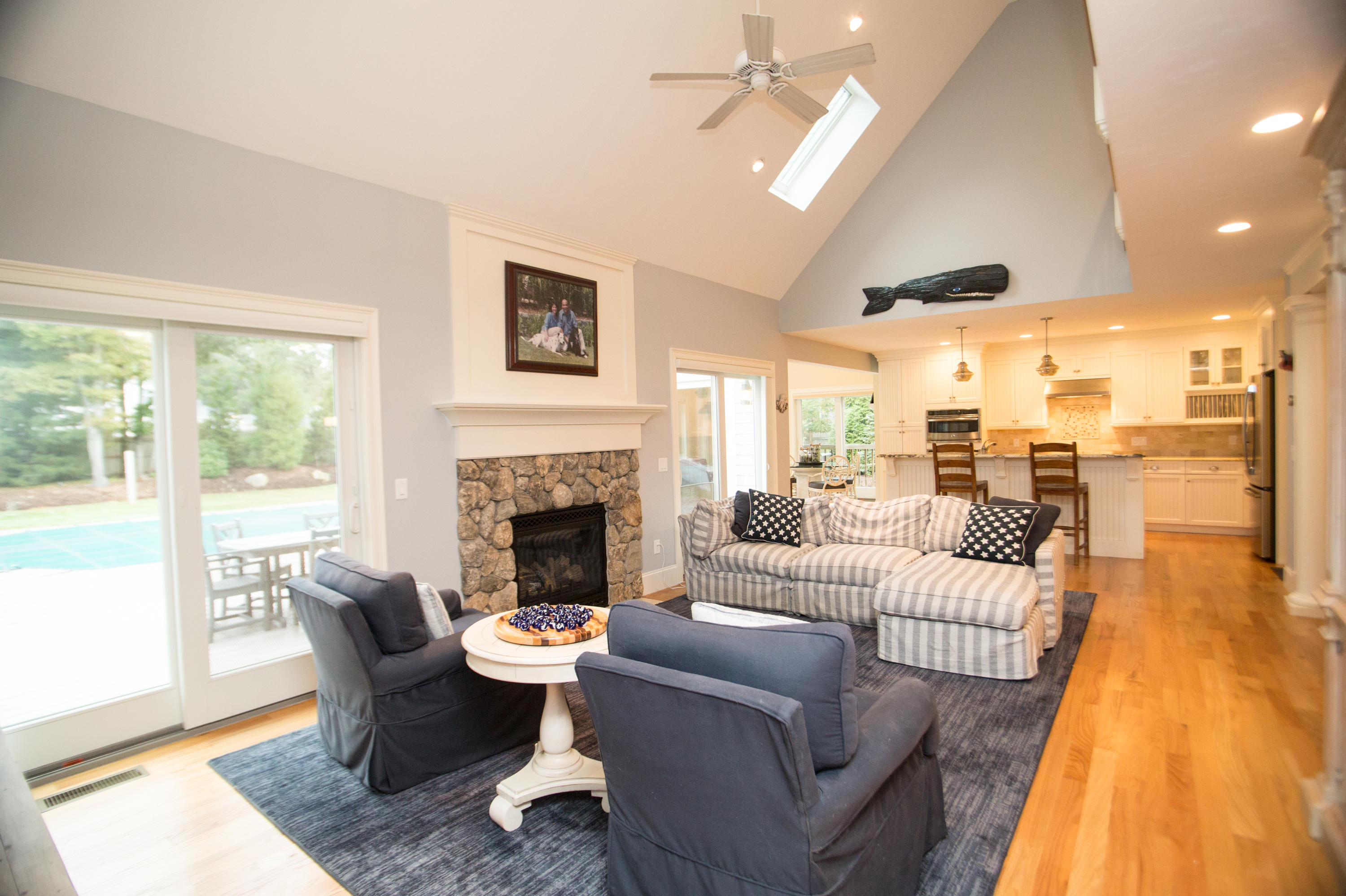 15 Center Lane Centerville, MA 02632 - Photo 12 of 36 a living room with furniture or outdoor view and a fireplace