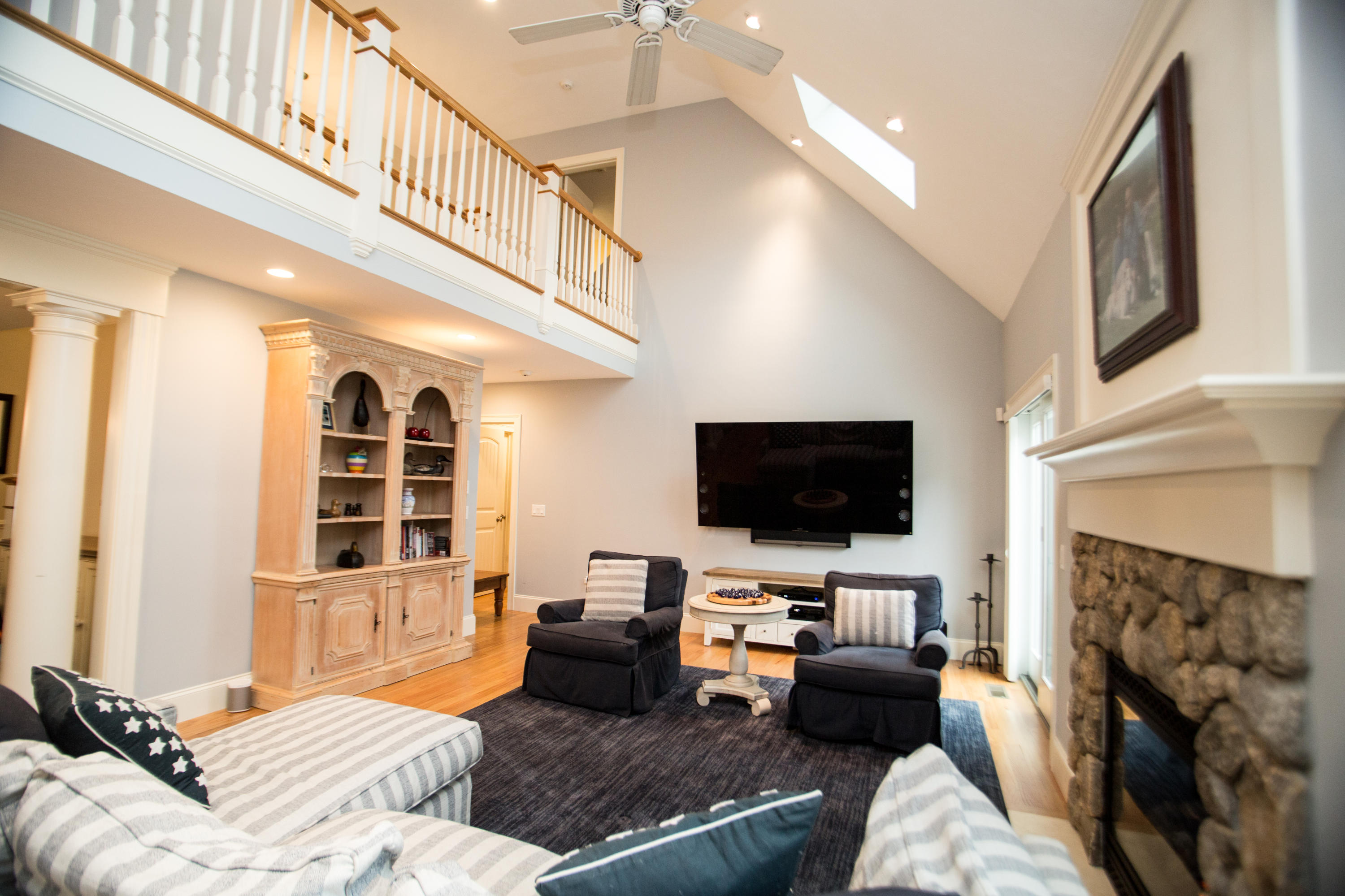 15 Center Lane Centerville, MA 02632 - Photo 14 of 36 a living room with fireplace furniture and a flat screen tv