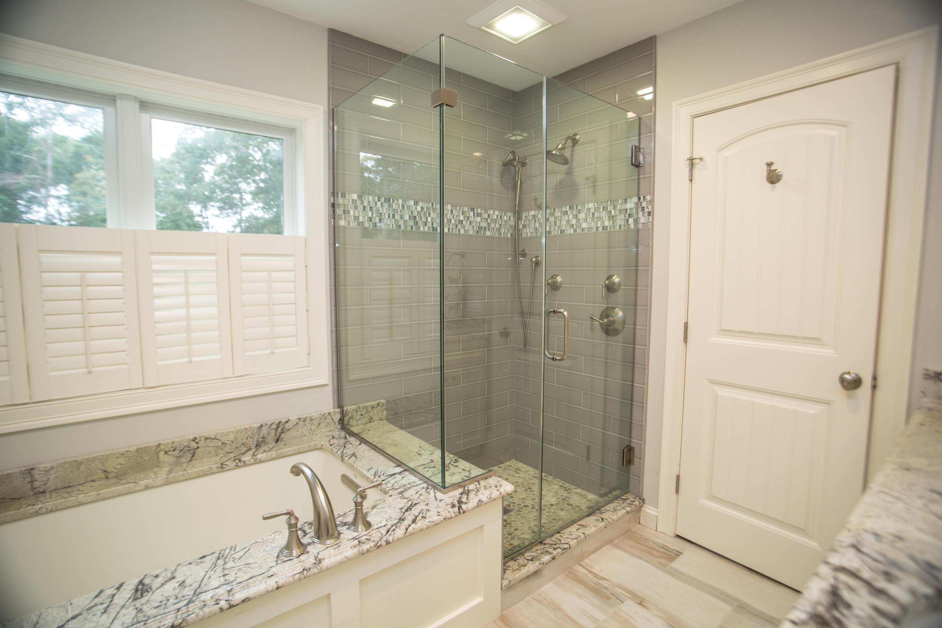 15 Center Lane Centerville, MA 02632 - Photo 19 of 36 a bathroom with a granite countertop tub shower and sink
