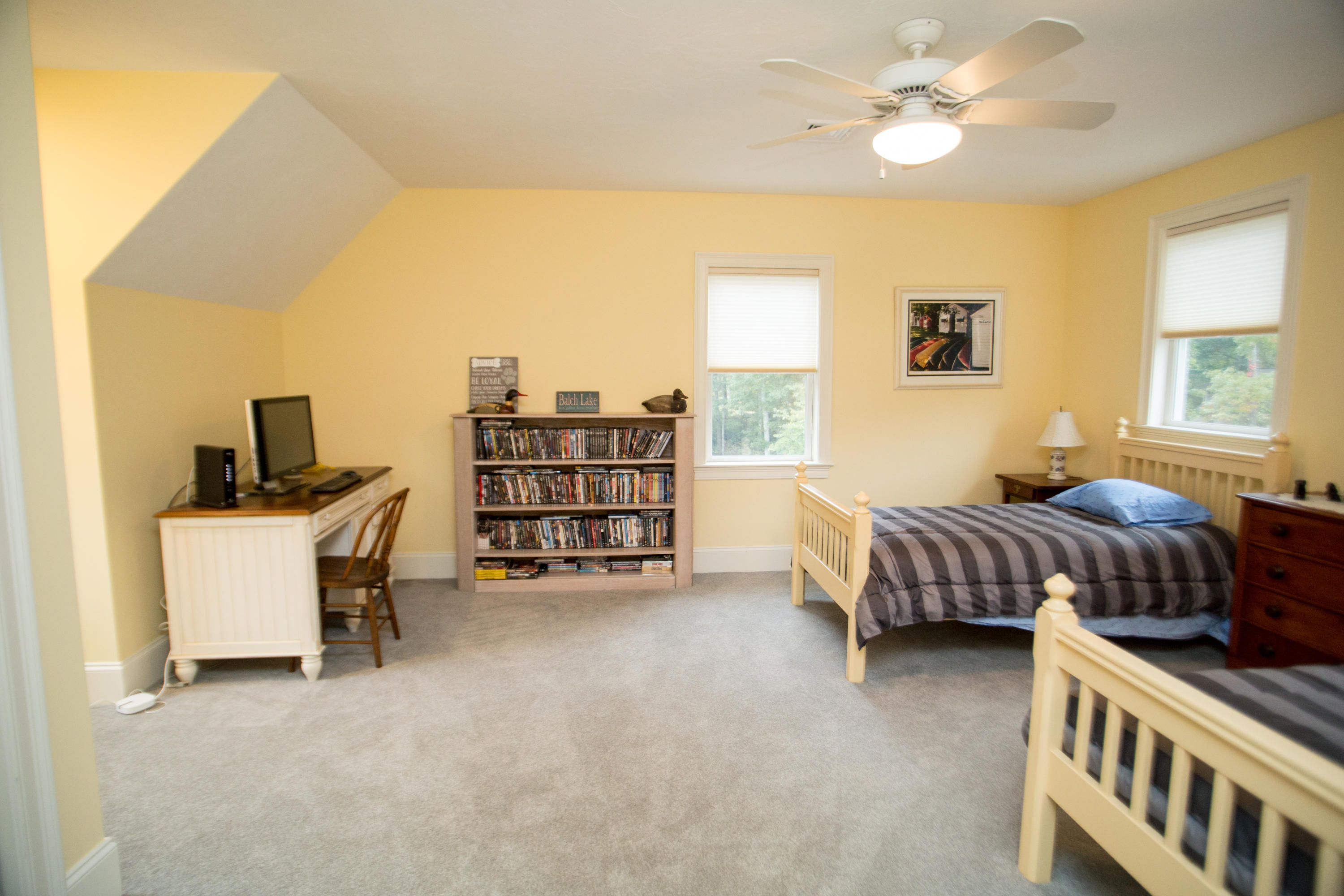 15 Center Lane Centerville, MA 02632 - Photo 20 of 36 a bedroom with a bed and a chandelier