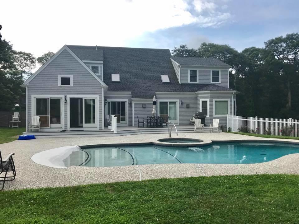 15 Center Lane Centerville, MA 02632 - Photo 2 of 36 a front view of a house with swimming pool having outdoor seating