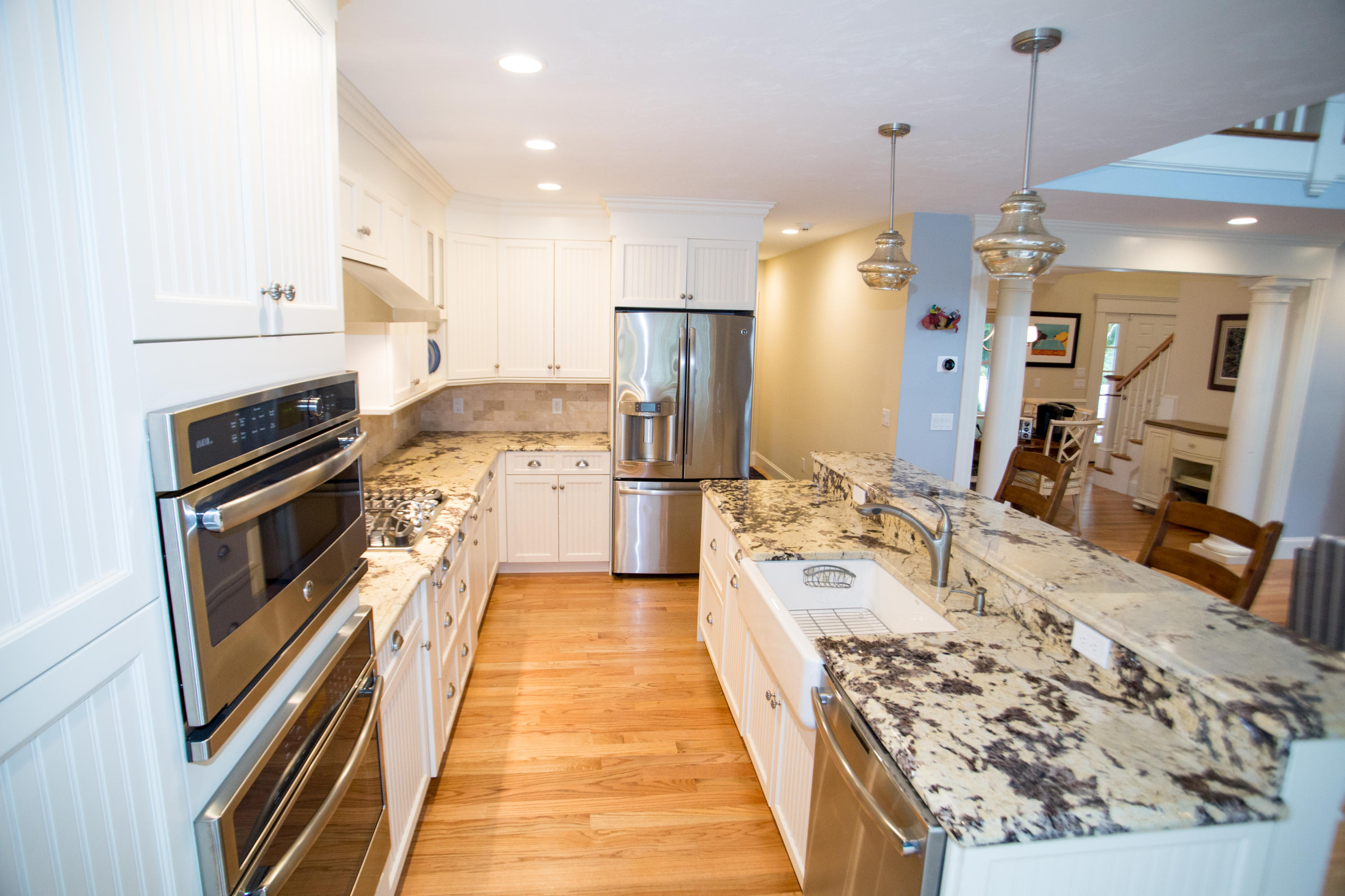 15 Center Lane Centerville, MA 02632 - Photo 8 of 36 a large kitchen with kitchen island granite countertop a large counter top and stainless steel appliances