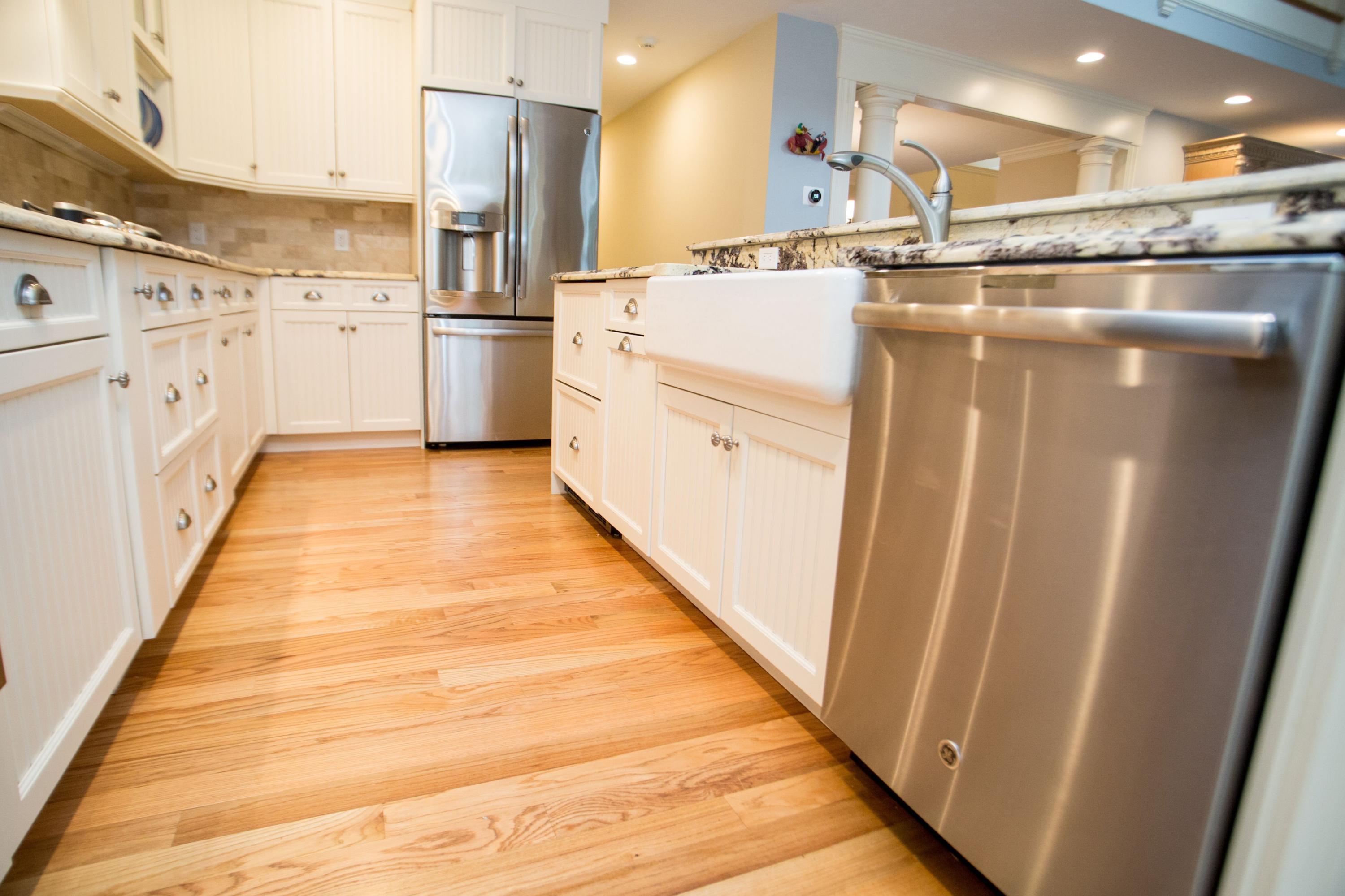 15 Center Lane Centerville, MA 02632 - Photo 10 of 36 a kitchen with white cabinets and white appliances