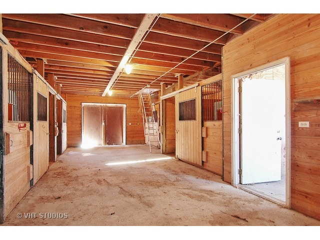 19N310 Boyer Road Algonquin, IL 60102 - Photo 20 of 25 a view of a hallway with wooden floor