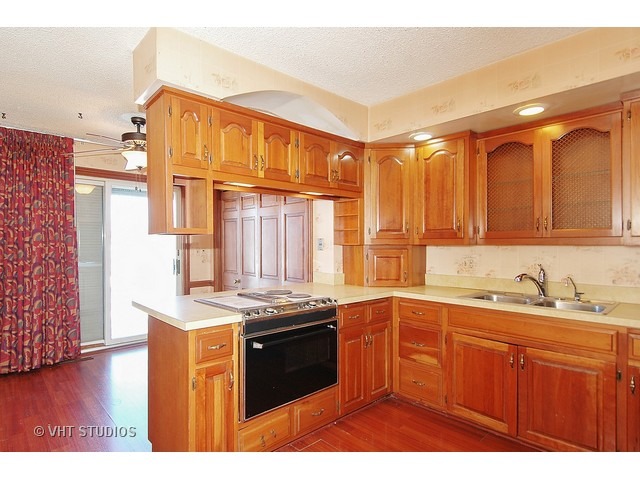 19N310 Boyer Road Algonquin, IL 60102 - Photo 5 of 25 a kitchen with stainless steel appliances granite countertop a sink stove and refrigerator