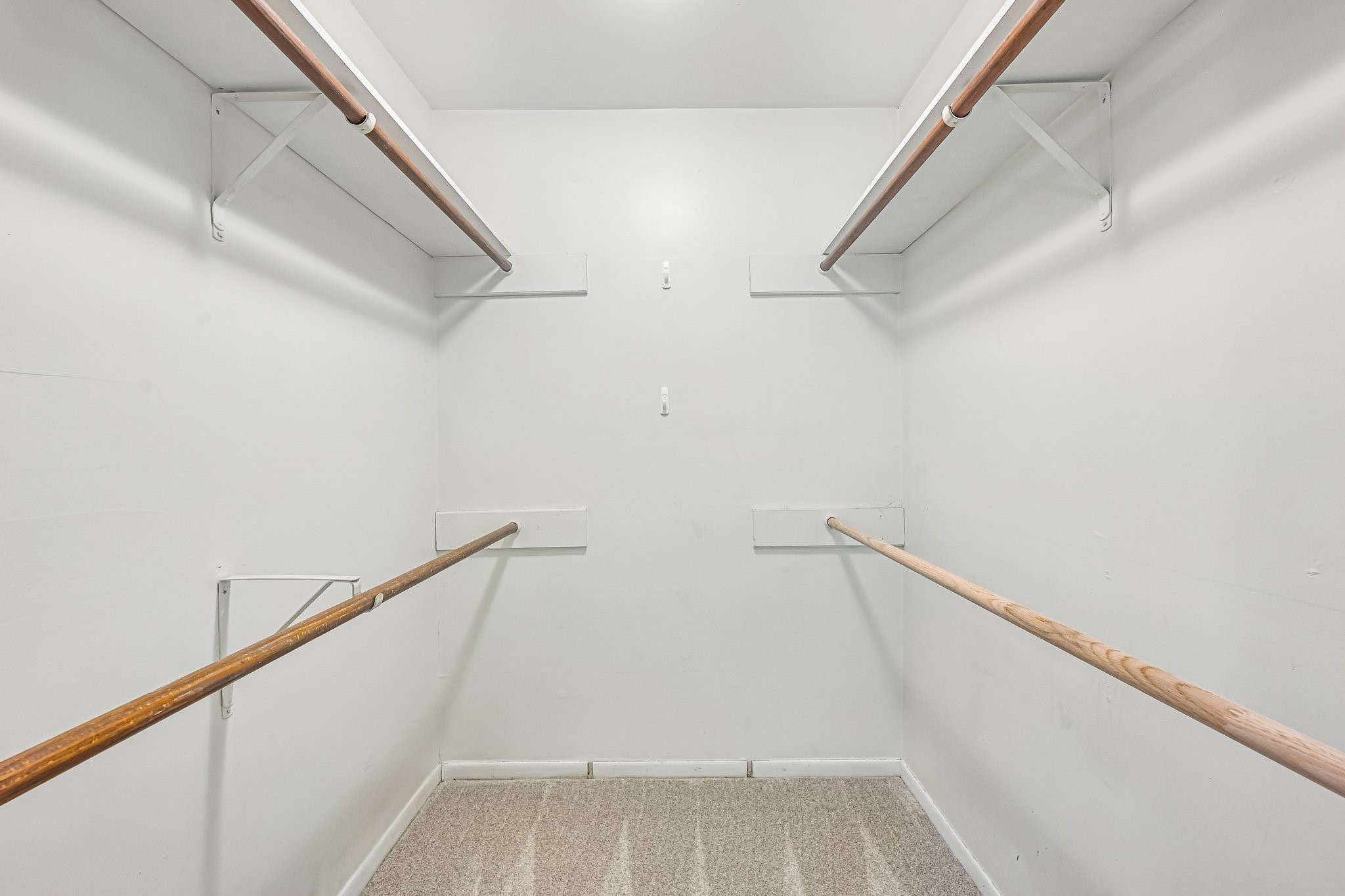 8 Arlington Street Conroe, TX 77301 - Photo 26 of 37 Plenty of room for your clothes in this primary bedroom walk-in closet.