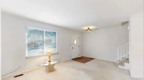 a view of a room with a window