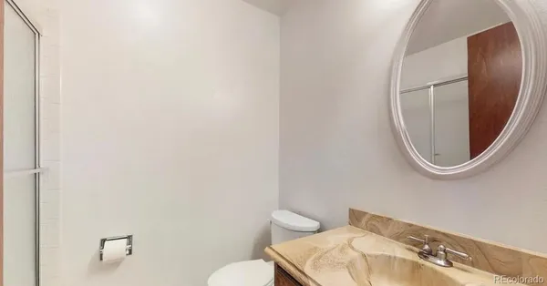 a bathroom with a toilet and a sink