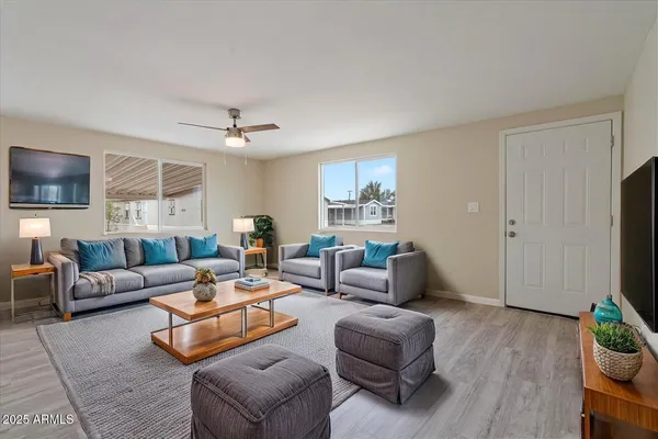a living room with furniture and a flat screen tv