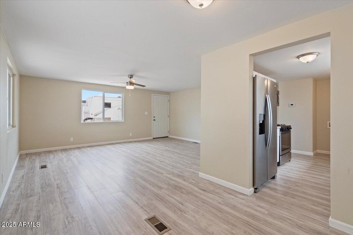 320 East McKellips Road, Unit 209 Mesa, AZ 85201 - Photo 12 of 25 wooden floor in an empty room with a window