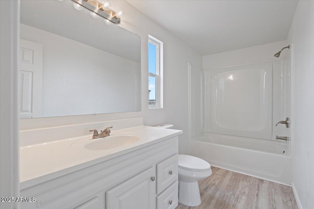 320 East McKellips Road, Unit 209 Mesa, AZ 85201 - Photo 18 of 25 a bathroom with a sink a toilet and shower