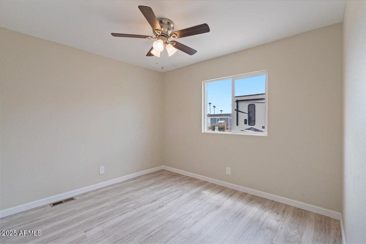 320 East McKellips Road, Unit 209 Mesa, AZ 85201 - Photo 20 of 25 an empty room with a window