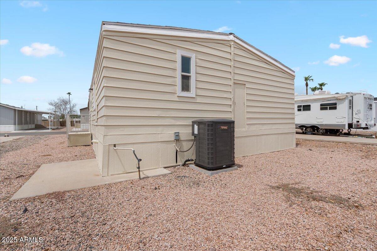 320 East McKellips Road, Unit 209 Mesa, AZ 85201 - Photo 25 of 25 a view of a house with a backyard