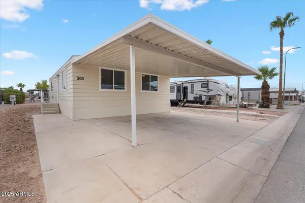 a garage with view of the house