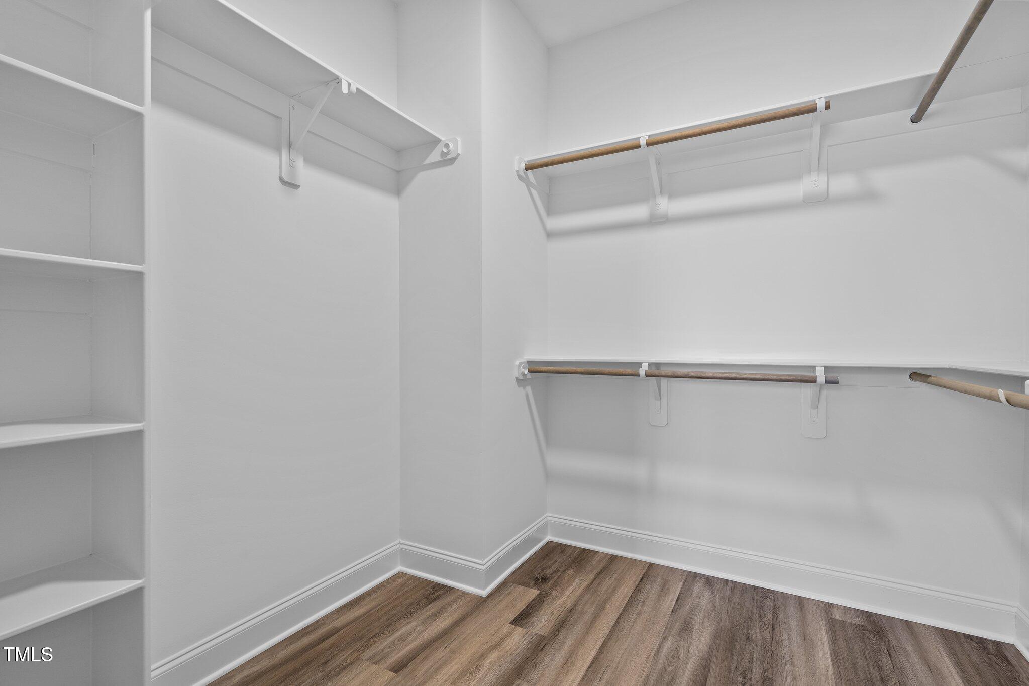 703 Jamescroft Way, Unit 13 Rolesville, NC 27571 - Photo 12 of 36 a view of an empty walk in closet