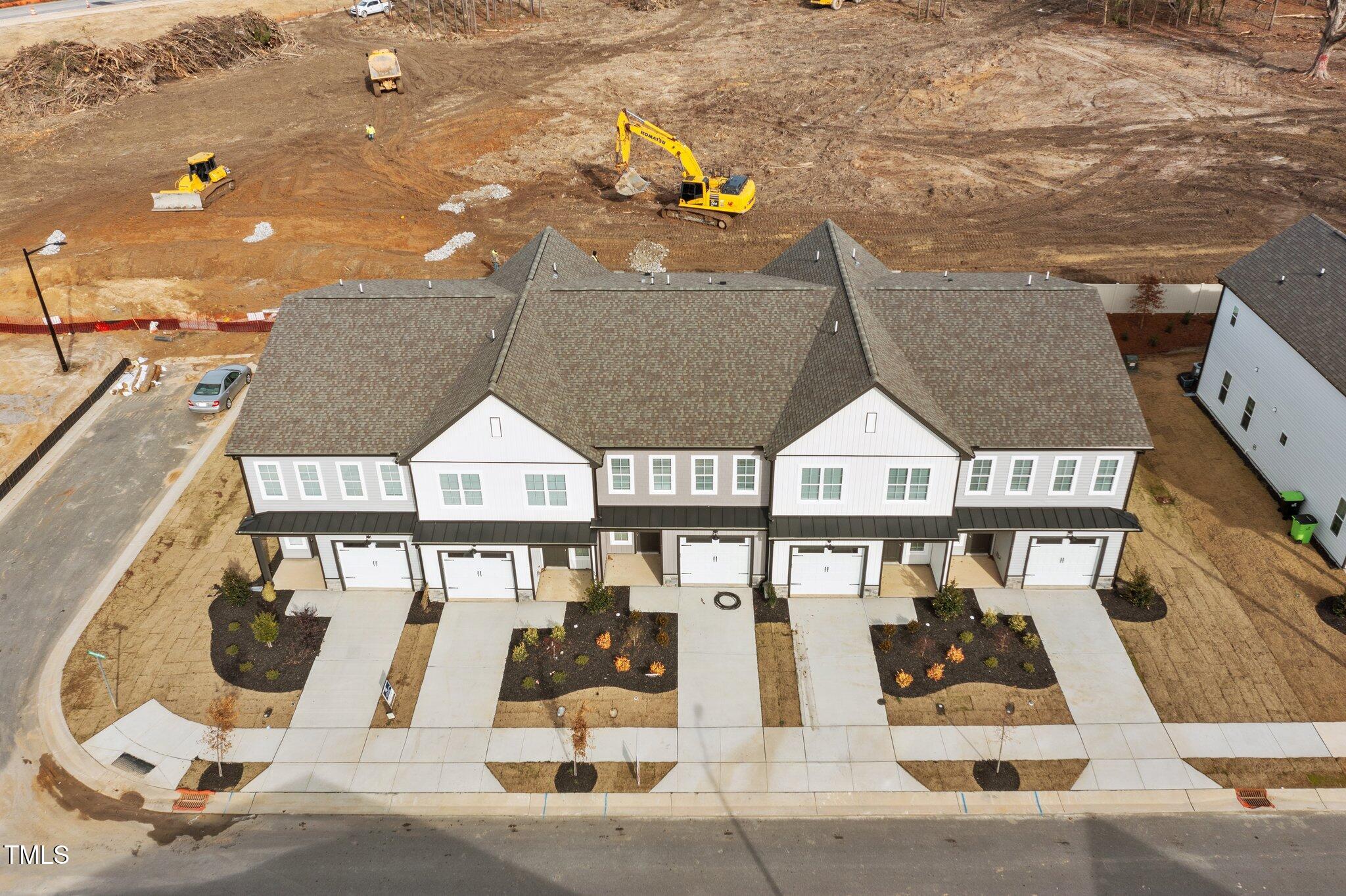 703 Jamescroft Way, Unit 13 Rolesville, NC 27571 - Photo 22 of 36 a view of a brick house with large windows