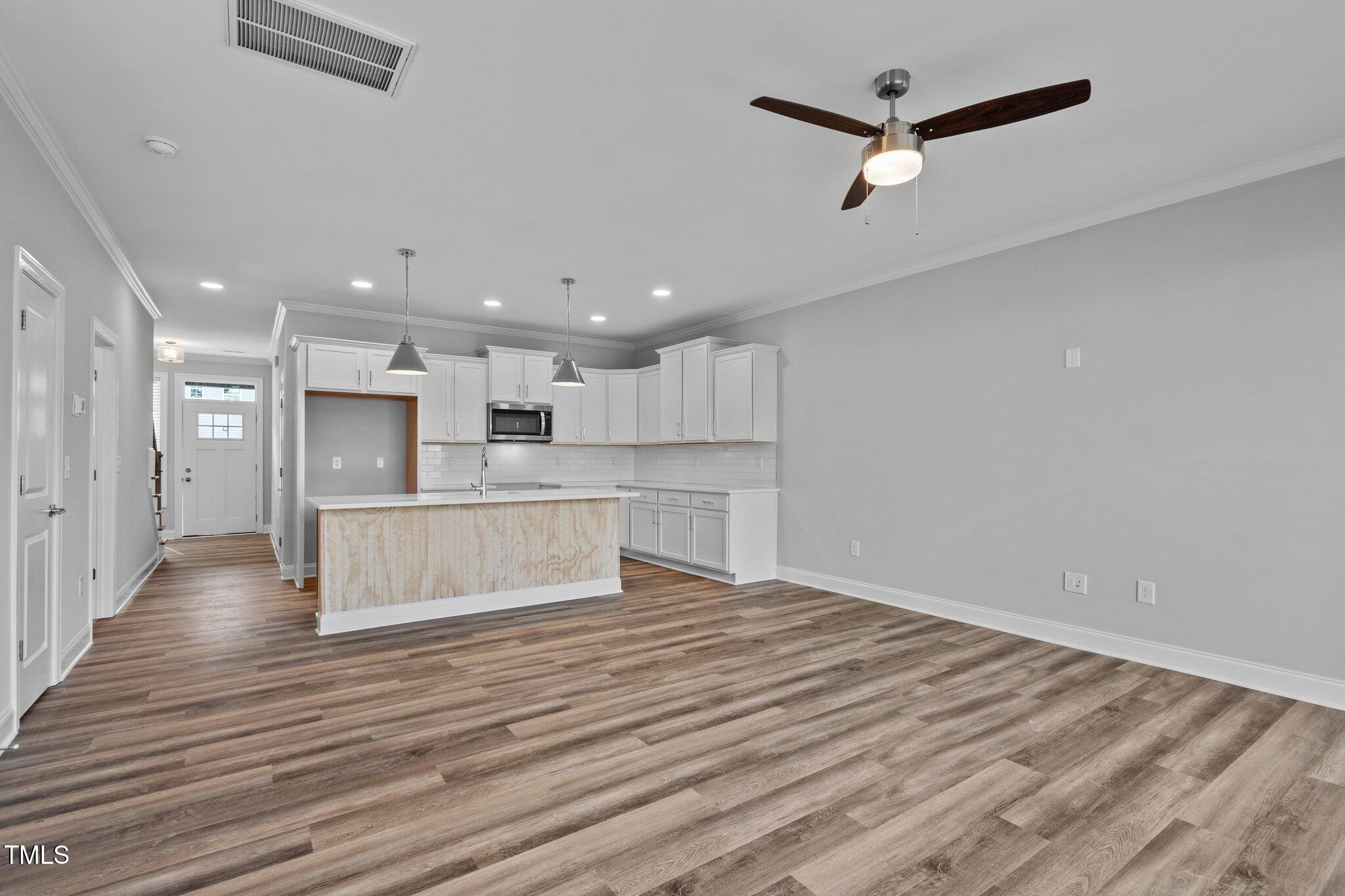 703 Jamescroft Way, Unit 13 Rolesville, NC 27571 - Photo 8 of 36 a view of kitchen with wooden floor and electronic appliances