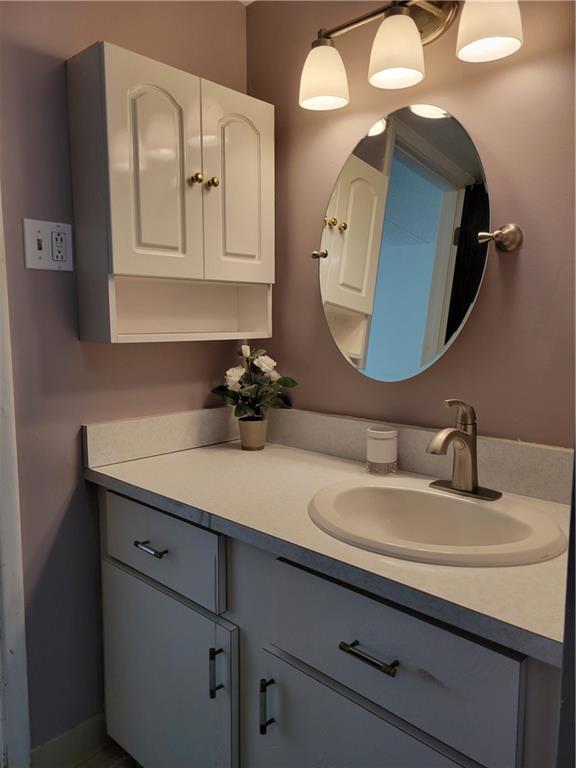2120 Greentree Road, Unit 100E Pittsburgh, PA 15220 - Photo 14 of 25 a bathroom with a double vanity sink and mirror