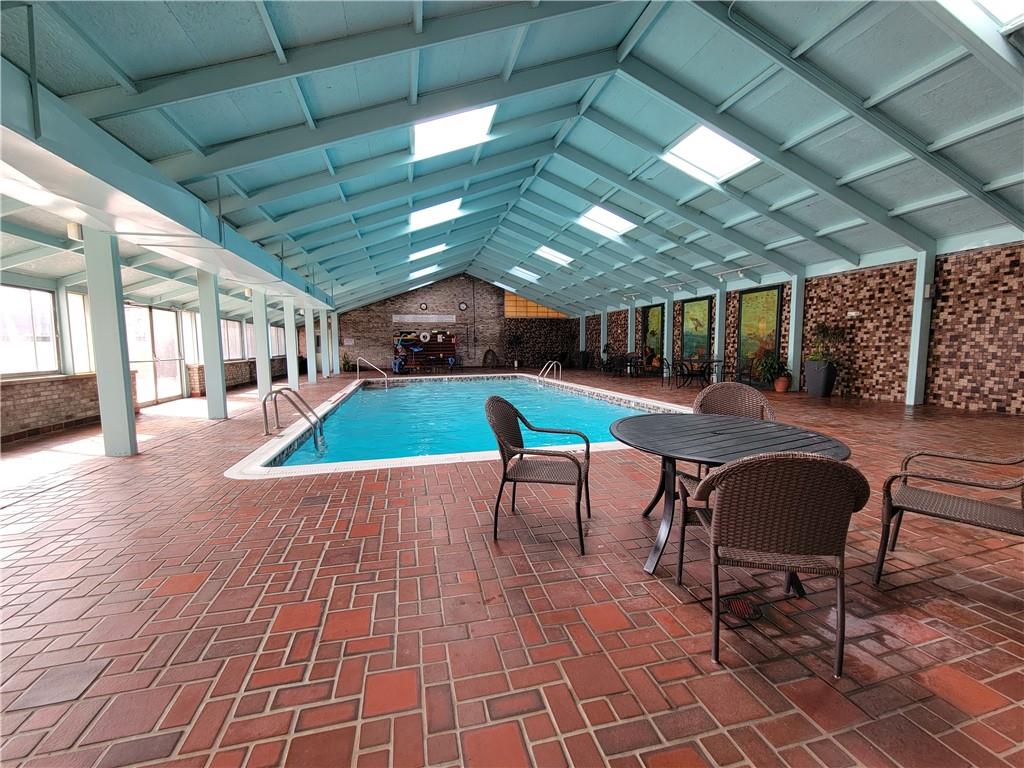 2120 Greentree Road, Unit 100E Pittsburgh, PA 15220 - Photo 23 of 25 a room with lots of furniture and a swimming pool