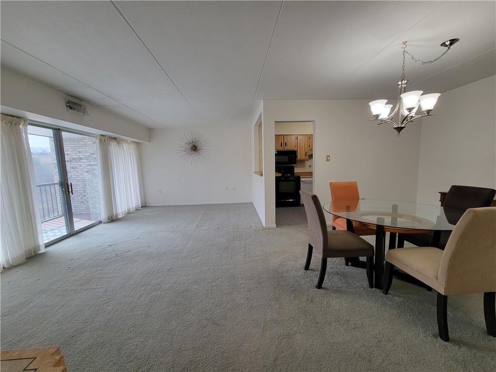 2120 Greentree Road, Unit 100E Pittsburgh, PA 15220 - Photo 3 of 25 a view of a livingroom with furniture and a chandelier