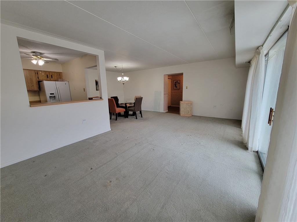 2120 Greentree Road, Unit 100E Pittsburgh, PA 15220 - Photo 7 of 25 a view of a livingroom with furniture and a ceiling fan