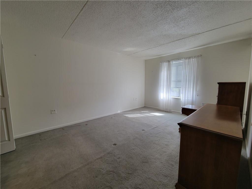 2120 Greentree Road, Unit 100E Pittsburgh, PA 15220 - Photo 10 of 25 a view of an empty room with a window