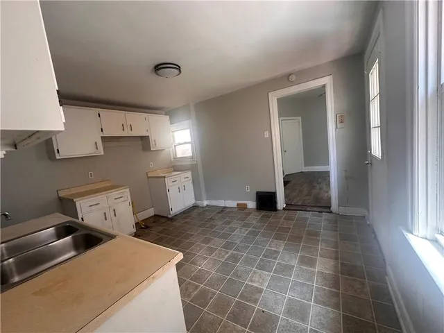 a view of a storage & utility room with two washing machine