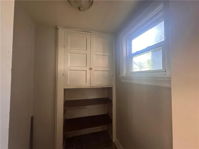 a room with storage and window