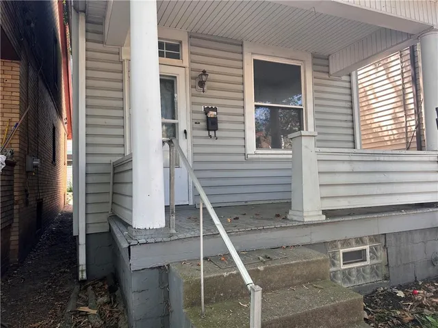 a house view with a backyard space