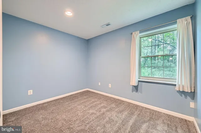 a view of bathroom with washer and dryer