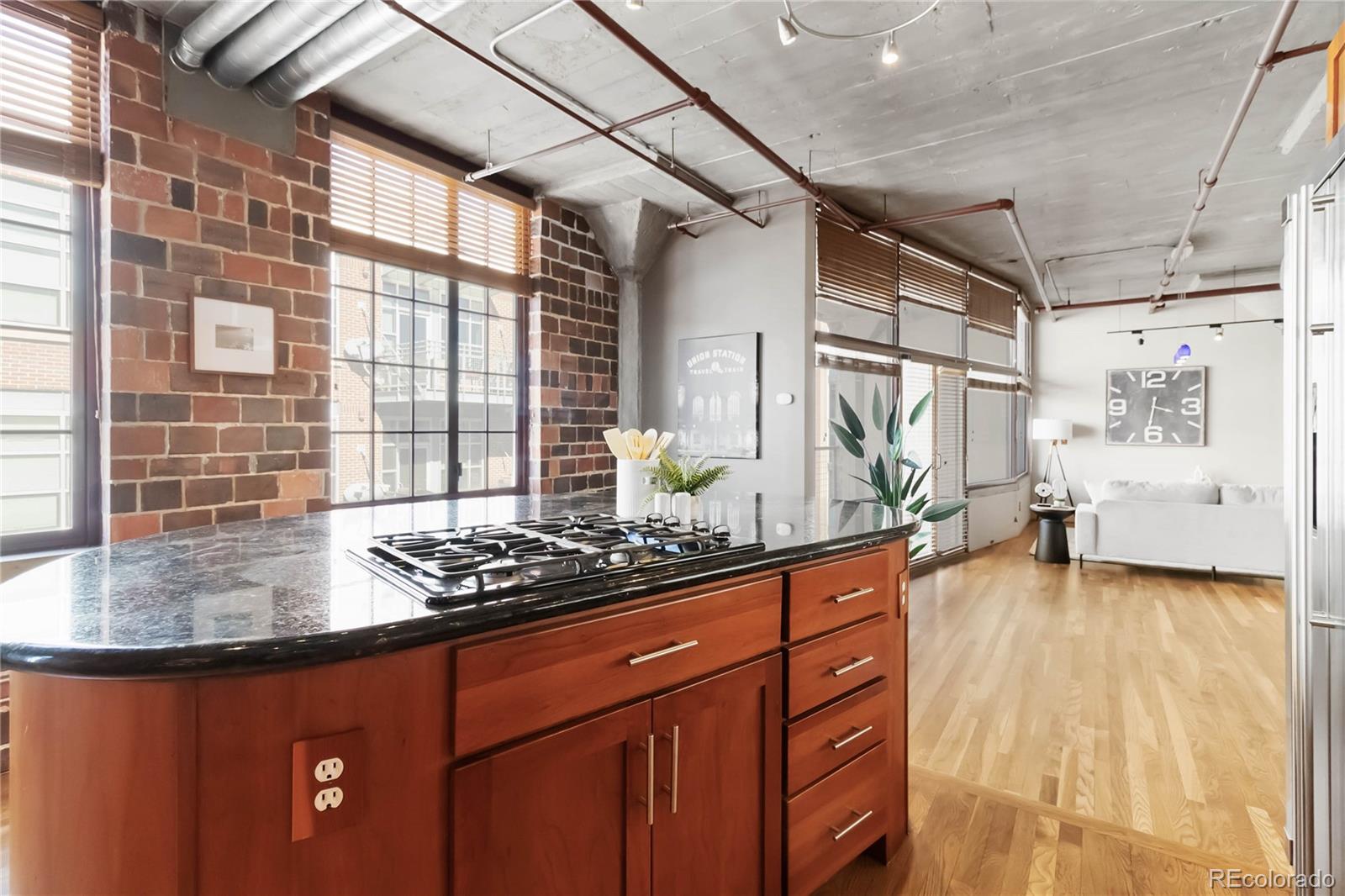 1863 Wazee Street, Unit 6E Denver, CO 80202 - Photo 26 of 49 a kitchen with sink window and cabinets