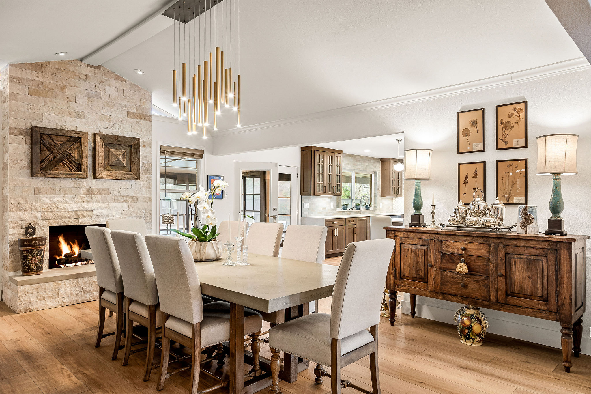 2505 Side Cove Austin, TX 78704 - Photo 13 of 40 Dining room view into the kitchen, with beautiful stone fireplace