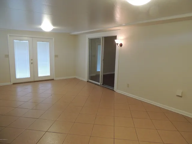 a view of an empty room with a window