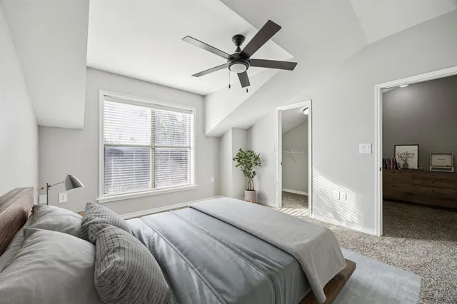a bedroom with a bed and window
