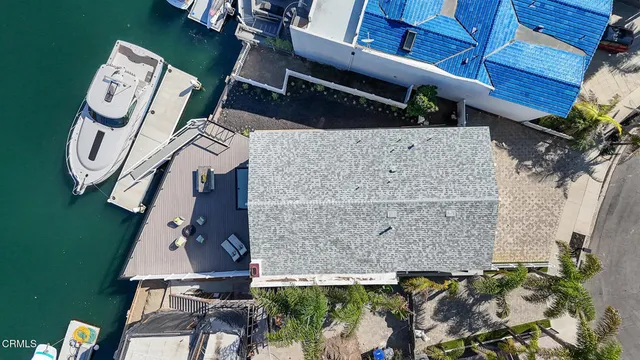 an aerial view of a house with garden space and balcony