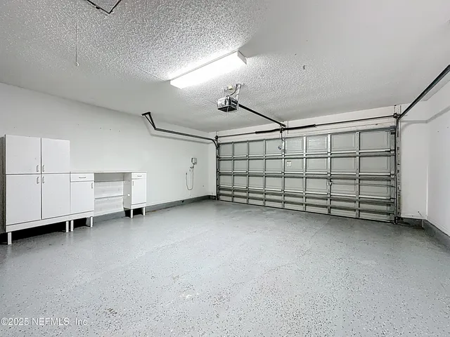 a view of back yard with swimming pool