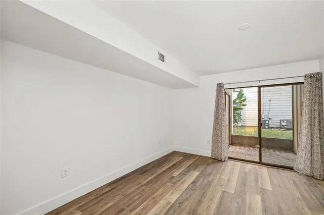 a bathroom with a granite countertop sink toilet a large mirror a shower and a mirror