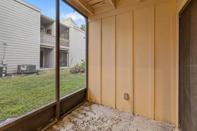 a view of room with window and wooden floor