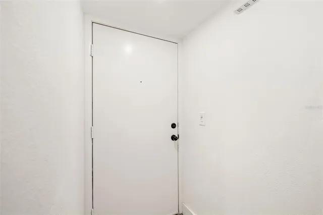 a front view of a building with a garden