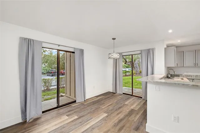 a view of a kitchen with a sink and a window