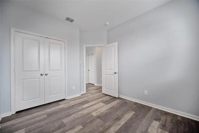 a view of a livingroom with wooden floor