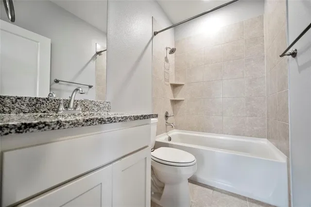 a bathroom with a sink a toilet and a bathtub