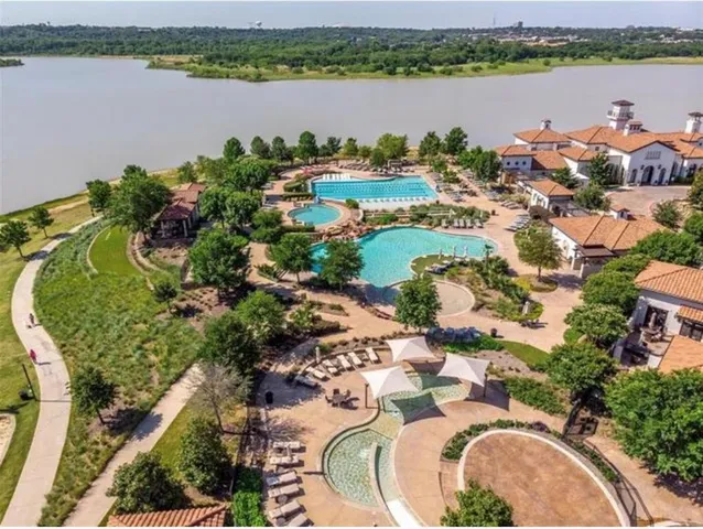 an aerial view of a house with a lake view and mountain view